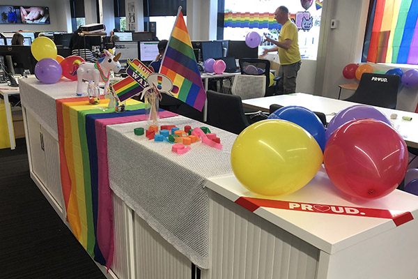 Photo of MediaWorks office decorated with Rainbow flags and Pride decorations