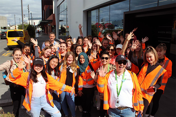 photo of young women in high-vis jackets