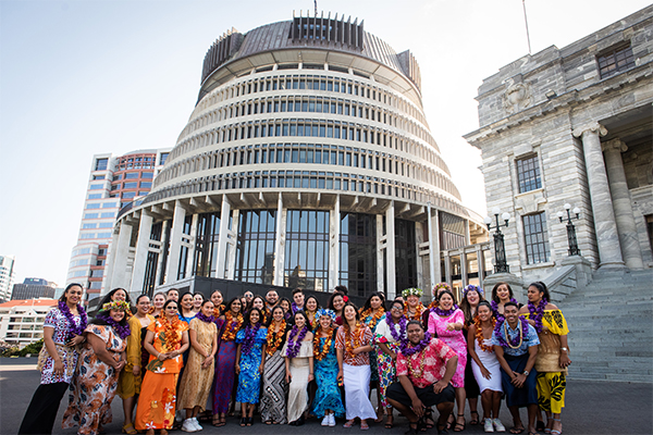 Photo of Pasifika interns from the Ministry of Business, Innovation and Employment standing in front of The Beehive in Wellington